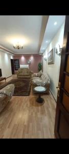 a living room with a couch and a table at VIP Apartment حامعه الدول العربيه Mohandsein in Cairo