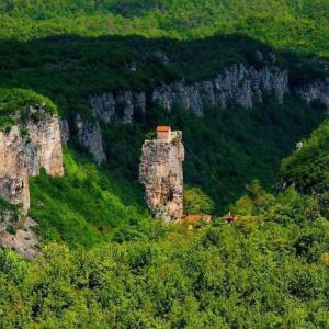 a building on the side of a mountain at Dito’s house in Katsʼkhi +9 photos