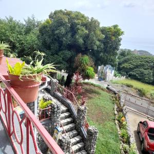 Vrt pred nastanitvijo Canefield sea view apartment
