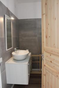 a bathroom with a white sink and a mirror at CaSAle in Castelfidardo +43 photos