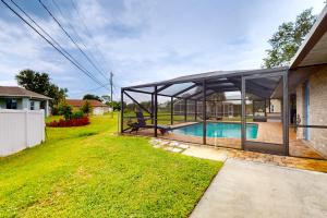 a house with a swimming pool in the backyard at Sunny Sebastian in Sebastian