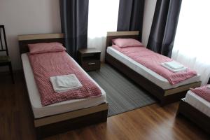 Кровать или кровати в номере Агроусадьба Бульбашик