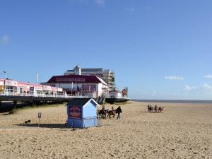 a group of people riding horses on the beach at Apartment 3 The Beach Hut - Uk31822 in Great Yarmouth
