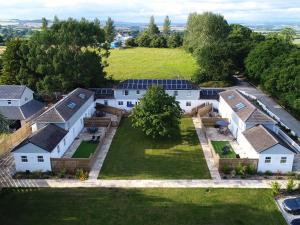 an aerial view of a house with solar panels on it at Beech Cottage - Uk11845 in Saltash