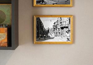 a black and white picture of a street on a wall at Dar Isla, in the heart of the Three Cities, Malta in Senglea
