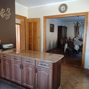 a kitchen with a counter and a dining room at Na Markówce in Brenna