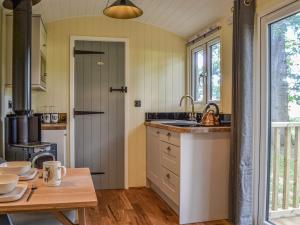 a kitchen with a sink and a table at Oak - Ukc4846 in Cantley