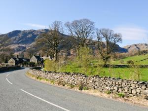 a stone wall on the side of a road at Wetherlam - E3829 in Lowick Green