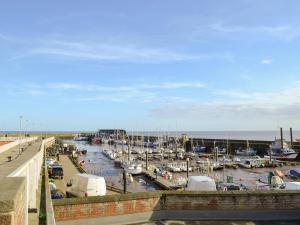 a marina with many boats in the water at Puffin Cottage in Bempton