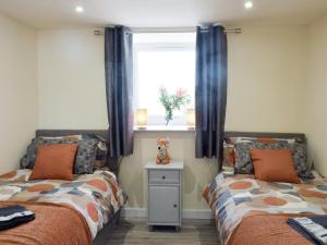 Un pat sau paturi într-o cameră la Uk7385 - Chaff House