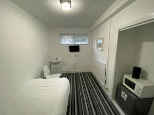 TV a/nebo společenská místnost v ubytování Aaran Central Guesthouse