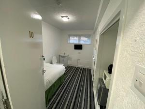 Postel nebo postele na pokoji v ubytování Aaran Central Guesthouse