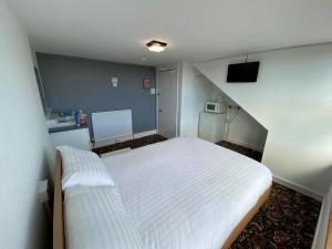 Postel nebo postele na pokoji v ubytování Aaran Central Guesthouse