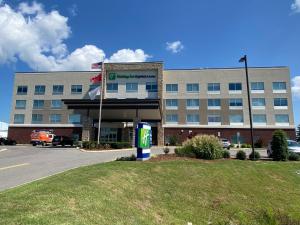 a building with a gas pump in front of it at Holiday Inn Express & Suites Nashville North - Springfield, an IHG Hotel in Springfield