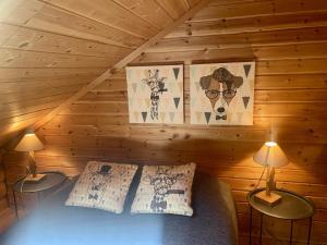 a bedroom with a bed in a wooden cabin at Appartement Les Angles, 4 pièces, 6 personnes - FR-1-758-11 in Les Angles