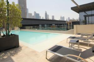 a swimming pool on the roof of a building at WORLD CLASS 3BR in the HEART of DUBAI in Dubai