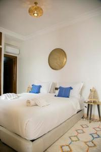 Cama ou camas em um quarto em Riad Sabria