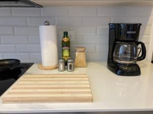 a kitchen counter with a cutting board and a blender at Unique Studio Apartment in the heart of Guatemala City in Guatemala