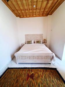 Postel nebo postele na pokoji v ubytování Riad Al Manara