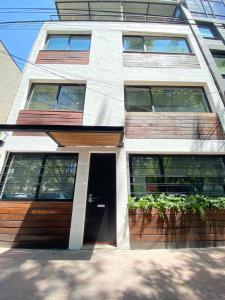 a house with a door in the side of it at Darwin 8 in Mexico City