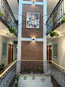 a brick building with a clock on top of it at Hotel Jar8 Bule in Boca del Río