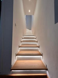 a stairway with wooden steps in a building at La Loggia dei Mercanti in Cuneo