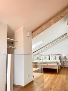 a bedroom with a bed in a attic at La Loggia dei Mercanti in Cuneo