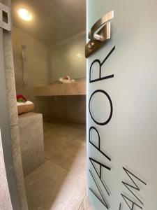 a bathroom with a shower and a sink in a room at Hit Hoteles Aeropuerto Puebla in Huejotzingo +13 photos