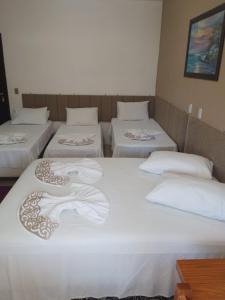 Cama o camas de una habitación en Pousada Mares de Penha
