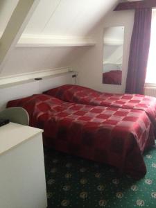 Un pat sau paturi într-o cameră la De Spaarbankhoeve