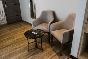 Predel za sedenje v nastanitvi Gold Source Hotel