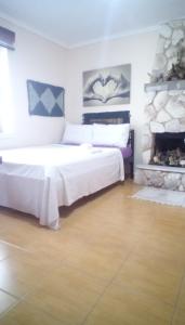 Ένα ή περισσότερα κρεβάτια σε δωμάτιο στο Argiris Old City House 1