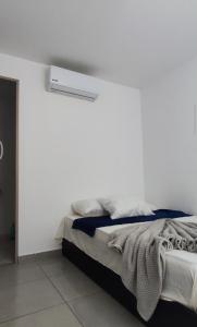 Ένα ή περισσότερα κρεβάτια σε δωμάτιο στο Apartamento 201 Palmar de los vientos +27 φωτογραφίες