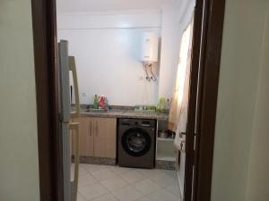 a kitchen with a washer and a washing machine at Dari A310 in Agadir +15 photos