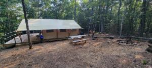 a large tent in the middle of a forest at Private place for rest in the forest Tent 1 Forrest Cump in Lenoir