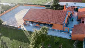 an overhead view of a building with a basketball court at Alojamento Monte dos Patos in Setúbal