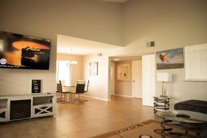 a living room with a table and chairs in it at Rancho Mirage Palm Springs Resort-Golf Tennis Pool in Rancho Mirage