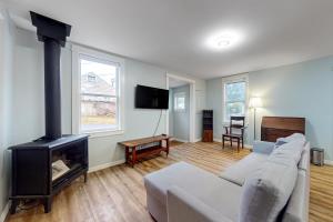a living room with a couch and a fireplace at The Quacker Jack in Port Orchard