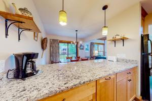a kitchen with a counter with a coffee maker on it at Trail Creek 42 in Killington