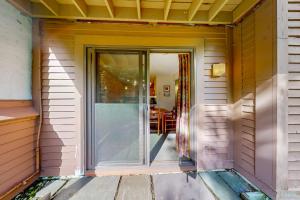 a sliding glass door on a house with a porch at Trail Creek 20 in Killington +22 photos