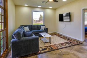 a living room with a couch and a tv at Pet Friendly Newton Guest House 2 Mi to Main St! in Newton