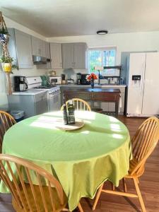 a kitchen with a table with a green table cloth on it at Santa Barbara Serenity Large 1-bedroom Guest Apt. in Santa Barbara