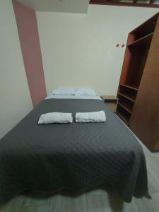 Кровать или кровати в номере Elsita departamento vacacional