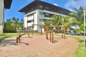 an empty playground in front of a building at Cupe Beach Living - Royal 206 in Porto De Galinhas