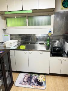 a kitchen with a sink and a counter top at Kohan no yado Kojima - Vacation STAY 34143v in Lake Toya