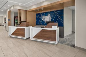 a lobby of a store with two counters at Holiday Inn Express - Hattiesburg West - Univ Area in Hattiesburg