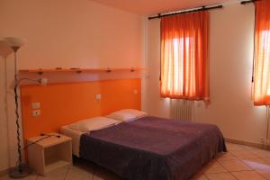 Posteľ alebo postele v izbe v ubytovaní Agriturismo Le Casette