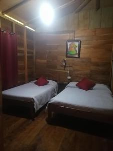 Tempat tidur dalam kamar di Rancho de Moncho