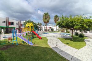 a playground with a slide in a park at Un espacio privado y cómodo. Casa Nahil. in Jalisco