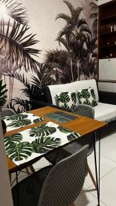 a dining room table with chairs and a couch at Copacabana in Beach in Rio de Janeiro